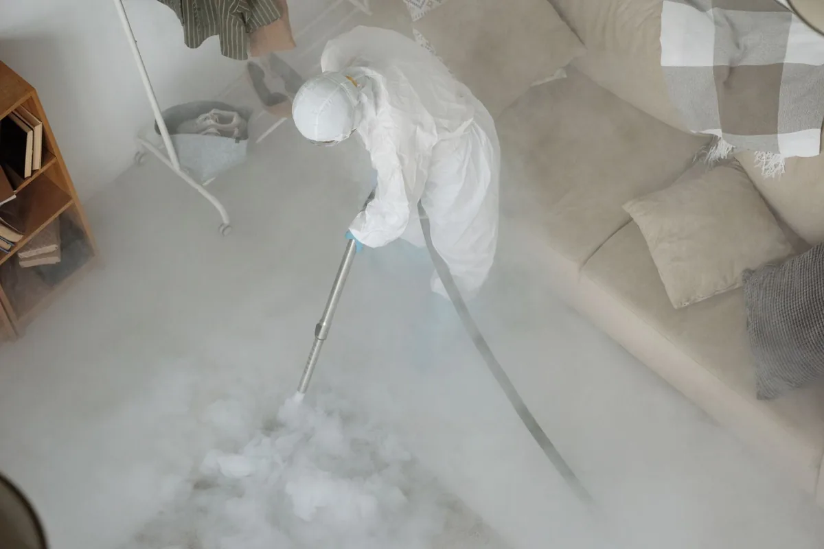 Biohazard cleanup technician in protective equipment, Twin Lakes, CO